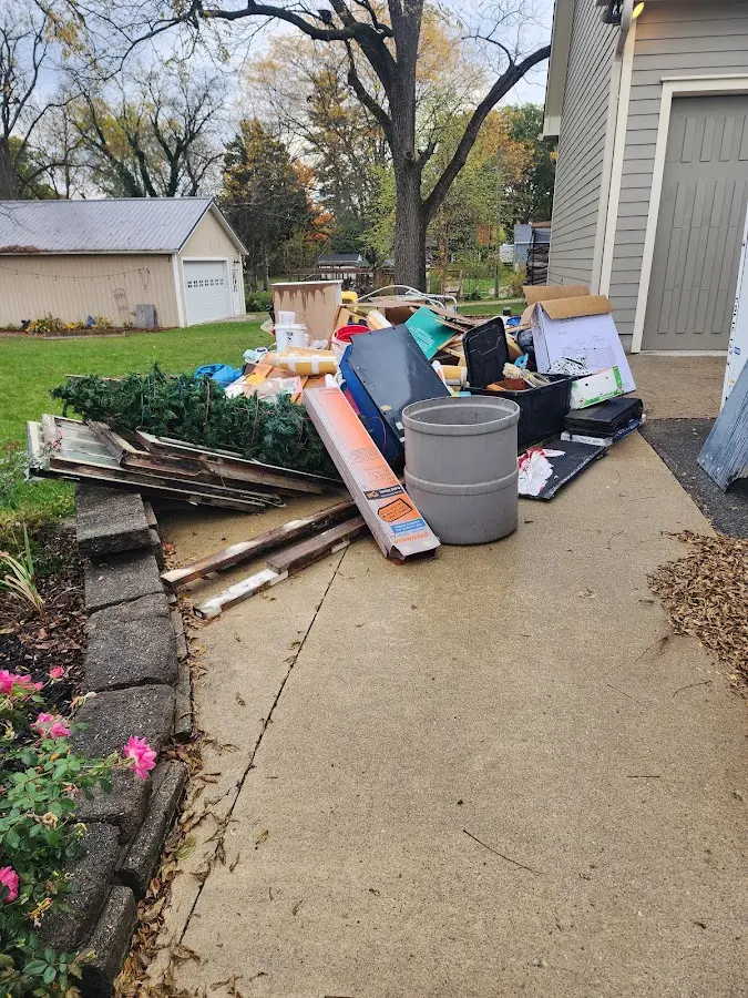 Dumpster being loaded with debris for Residential Dumpster Rental in Sun Prairie